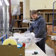 Packing a box to ship to a customer.